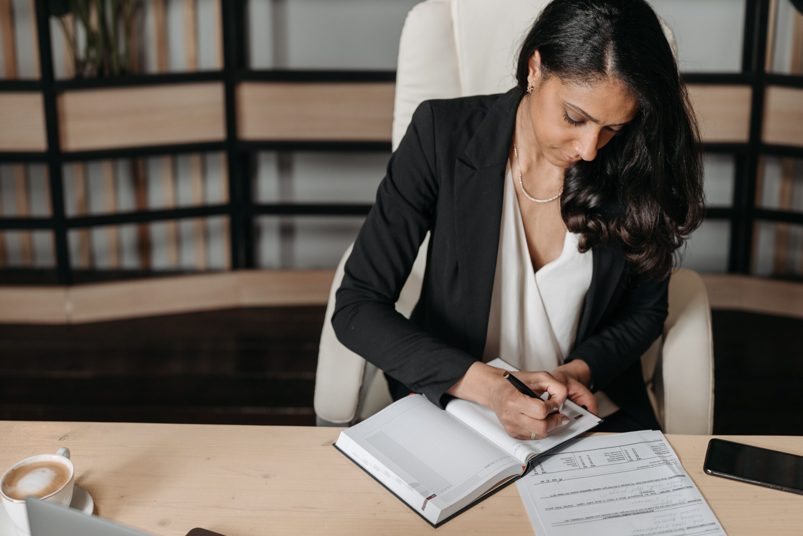 A lady making personal growth checklist