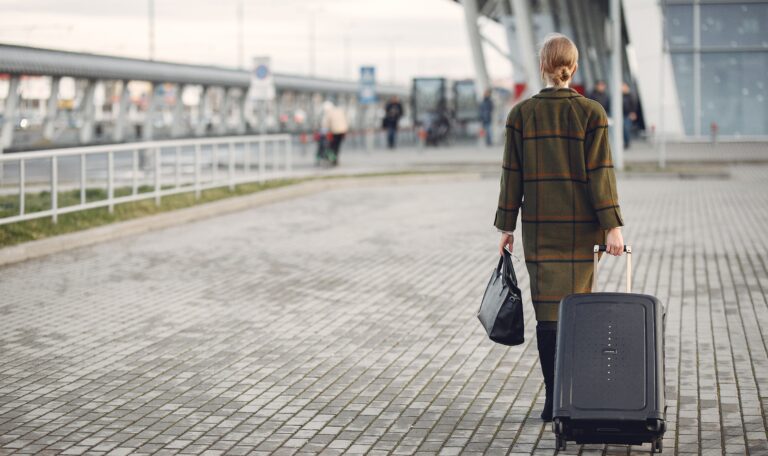 a woman with a suitcase traveling
