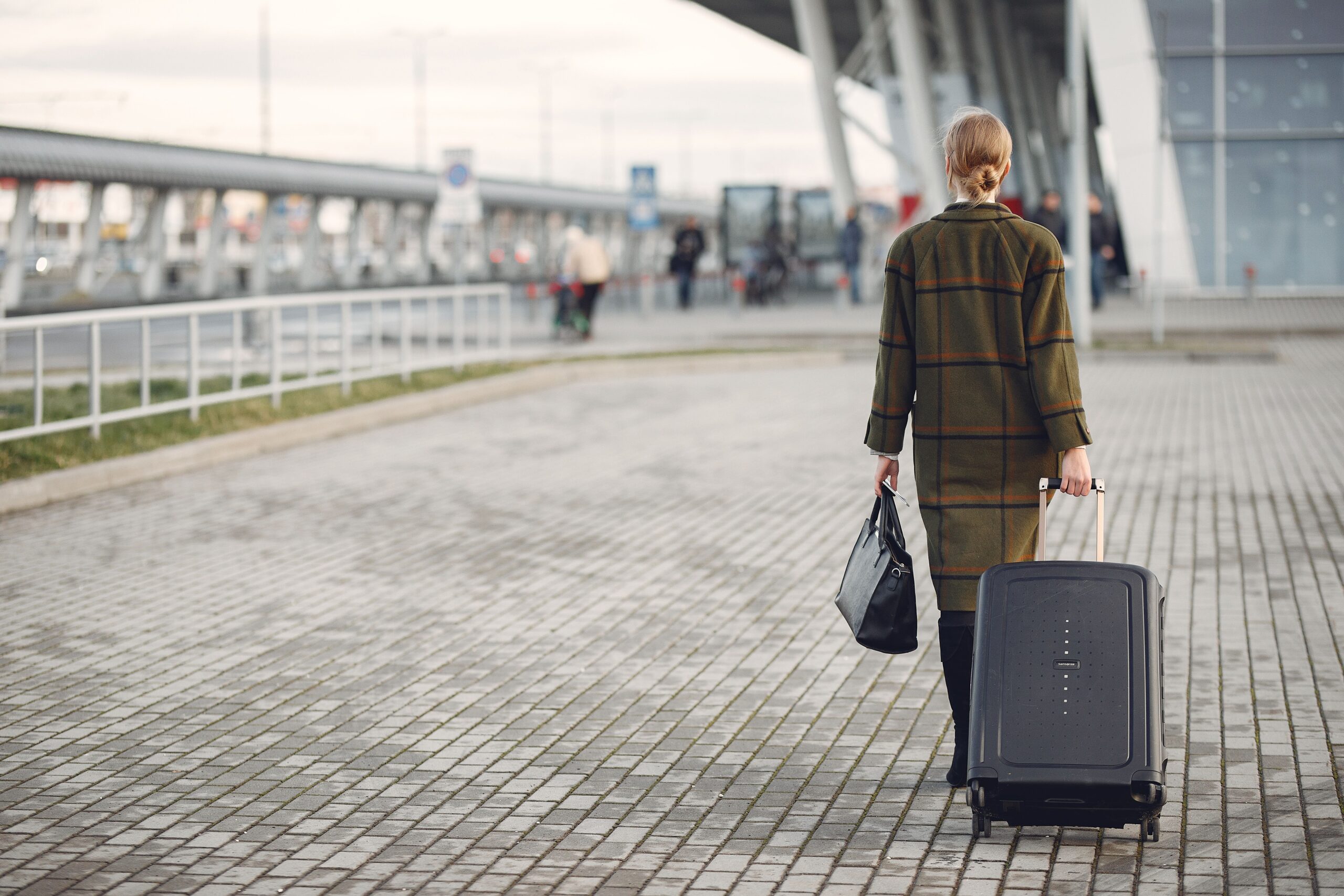 pexels-gustavo-fring-3885529 a woman with a suitcase traveling
